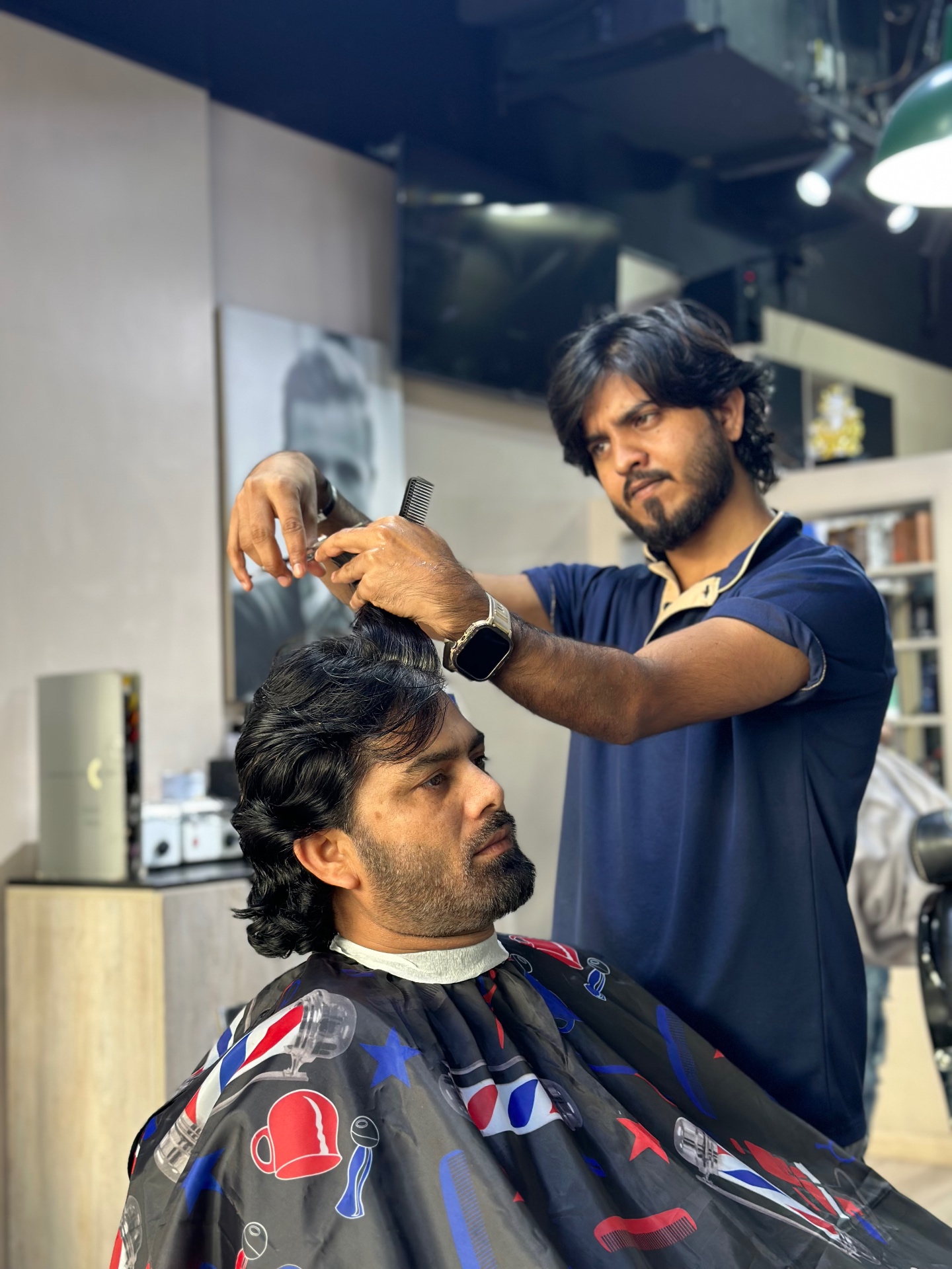 Precision haircut by master barber at Relaxxa